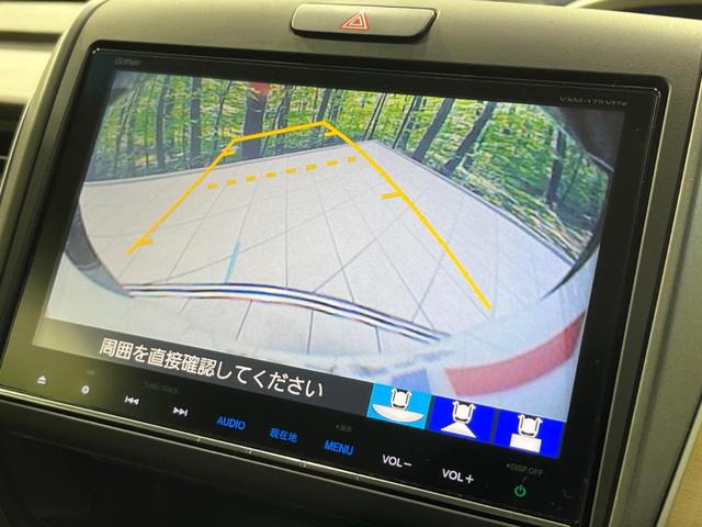 フリード G・ホンダセンシング 両側電動ドア 純正9型ナビ 後席モニター バックカメラ 寒冷地仕様 衝突軽減装置 レーダークルーズ 禁煙車 レーンキープ スマートキー LEDヘッド ETC 誤発進抑制機能 先行車発進告知 DVD再生(5枚目)