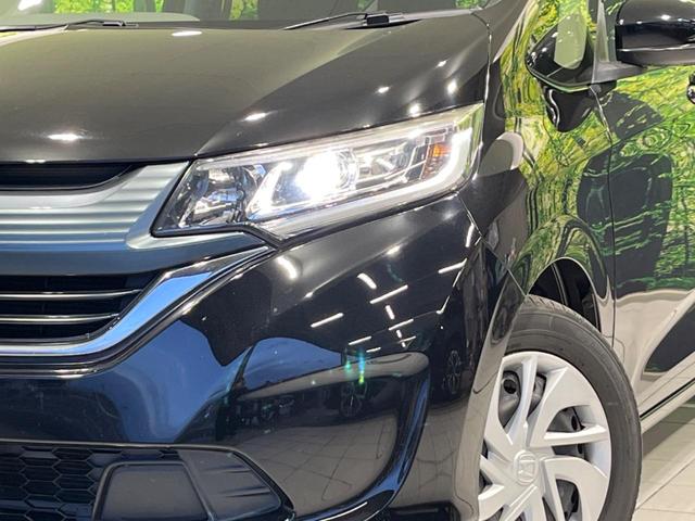 フリード G・ホンダセンシング 両側電動ドア 純正9型ナビ 後席モニター バックカメラ 寒冷地仕様 衝突軽減装置 レーダークルーズ 禁煙車 レーンキープ スマートキー LEDヘッド ETC 誤発進抑制機能 先行車発進告知 DVD再生(13枚目)
