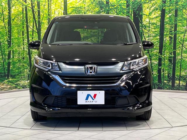 フリード G・ホンダセンシング 両側電動ドア 純正9型ナビ 後席モニター バックカメラ 寒冷地仕様 衝突軽減装置 レーダークルーズ 禁煙車 レーンキープ スマートキー LEDヘッド ETC 誤発進抑制機能 先行車発進告知 DVD再生(15枚目)