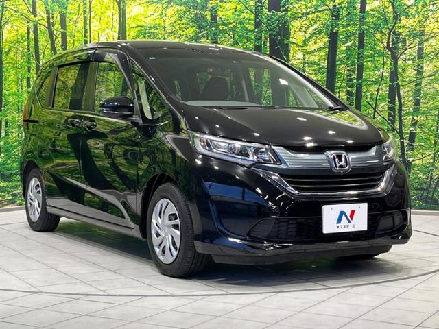フリード G・ホンダセンシング 両側電動ドア 純正9型ナビ 後席モニター バックカメラ 寒冷地仕様 衝突軽減装置 レーダークルーズ 禁煙車 レーンキープ スマートキー LEDヘッド ETC 誤発進抑制機能 先行車発進告知 DVD再生(17枚目)