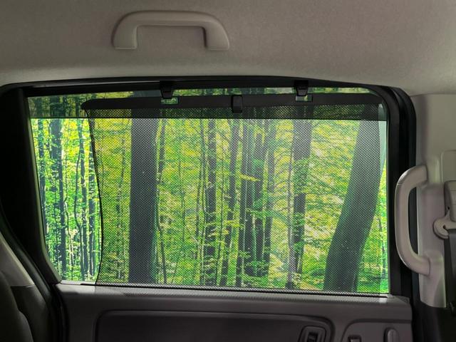 フリード G・ホンダセンシング 両側電動ドア 純正9型ナビ 後席モニター バックカメラ 寒冷地仕様 衝突軽減装置 レーダークルーズ 禁煙車 レーンキープ スマートキー LEDヘッド ETC 誤発進抑制機能 先行車発進告知 DVD再生(29枚目)