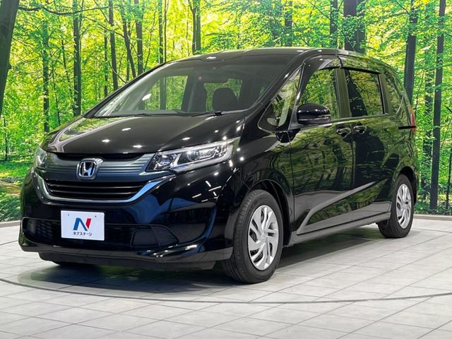 フリード G・ホンダセンシング 両側電動ドア 純正9型ナビ 後席モニター バックカメラ 寒冷地仕様 衝突軽減装置 レーダークルーズ 禁煙車 レーンキープ スマートキー LEDヘッド ETC 誤発進抑制機能 先行車発進告知 DVD再生(63枚目)