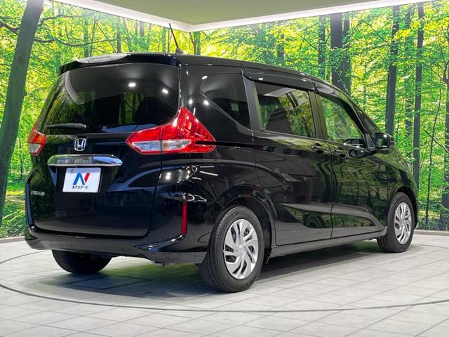 フリード G・ホンダセンシング 両側電動ドア 純正9型ナビ 後席モニター バックカメラ 寒冷地仕様 衝突軽減装置 レーダークルーズ 禁煙車 レーンキープ スマートキー LEDヘッド ETC 誤発進抑制機能 先行車発進告知 DVD再生(65枚目)