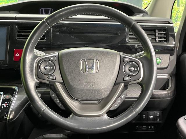 ステップワゴンスパーダ スパーダハイブリッド G ホンダセンシング 両側電動ドア 後席モニター 純正9型ナビ 全周囲カメラ アダプティブクルーズ 禁煙車 ドラレコ ETC スマートキー LEDヘッド 車線逸脱警報 誤発信抑制機能 先行車発進告知 CD DVD再生(12枚目)