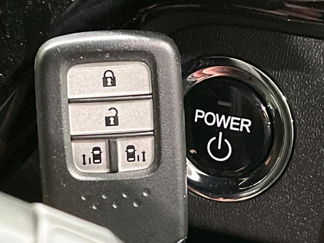 ステップワゴンスパーダ スパーダハイブリッド G ホンダセンシング 両側電動ドア 後席モニター 純正9型ナビ 全周囲カメラ アダプティブクルーズ 禁煙車 ドラレコ ETC スマートキー LEDヘッド 車線逸脱警報 誤発信抑制機能 先行車発進告知 CD DVD再生(28枚目)