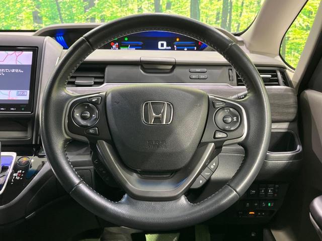 フリード＋ハイブリッド ハイブリッドＥＸ　両側電動ドア　純正９型ナビ　後席モニター　バックカメラ　衝突軽減装置　レーダークルーズ　禁煙車　ハーフレザーシート　シートヒーター　ドラレコ　スマートキー　ＬＥＤヘッド　ＥＴＣ　オートハイビーム（11枚目）