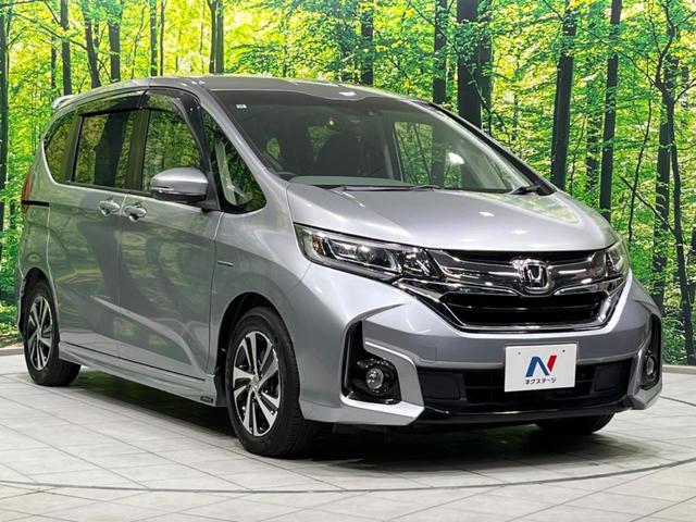 フリード＋ハイブリッド ハイブリッドＥＸ　両側電動ドア　純正９型ナビ　後席モニター　バックカメラ　衝突軽減装置　レーダークルーズ　禁煙車　ハーフレザーシート　シートヒーター　ドラレコ　スマートキー　ＬＥＤヘッド　ＥＴＣ　オートハイビーム（16枚目）