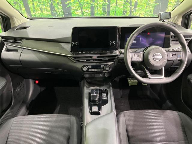 ノート Ｘ　純正９型ナビ　全周囲カメラ　衝突軽減装置　プロパイロット　禁煙車　シートヒーター　ドラレコ　コーナーセンサー　レーンキープ　ＬＥＤヘッド　ＥＴＣ　ステアリングヒーター　誤発進抑制機能　置くだけ充電（2枚目）