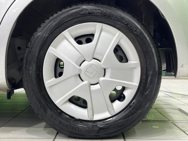 フィットハイブリッド ハイブリッド・10thアニバーサリー 純正ナビ バックカメラ 禁煙車 ドラレコ スマートキー HIDヘッド ETC クルコン オートライト オートエアコン CD DVD再生 地デジ ステアリングスイッチ アイドリングストップ(57枚目)