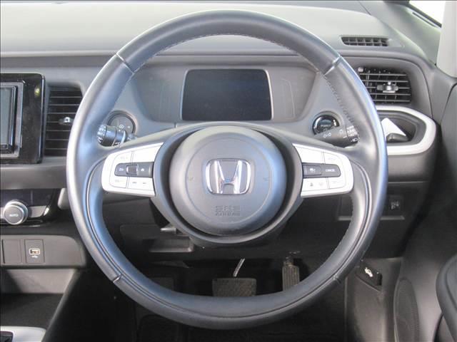 フィット e:HEV HOME 禁煙車 衝突軽減ブレーキ 歩行者事故低減ステアリング 誤発進抑制機能 近距離衝突軽減ブレーキ 渋滞追従機能付アダプティブクルーズコントロール 車線維持支援システム パーキングセンサーシステム(53枚目)