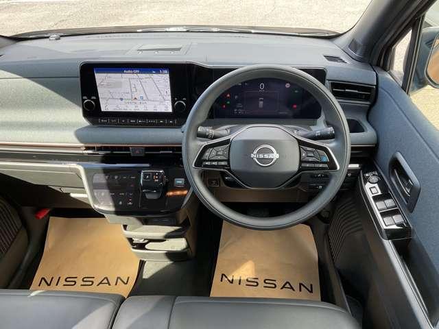 サクラ Ｘ　９０周年記念車　充電ケーブル有　試乗車ＵＰ　プロパイロット　メーカーナビＴＶ　エマージェンシーブレーキ　アラウンドビューモニター　障害物センサー　車線逸脱警報　シートヒーター　ドラレコ　ＥＴＣ　ＬＥＤライト　アルミ　インテリキー（4枚目）