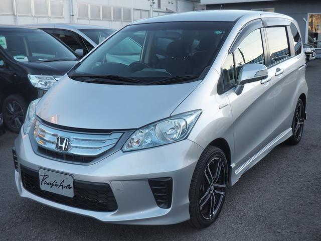 フリードハイブリッド ハイブリッド　９型ナビ　バックカメラ　電動ドア　６人乗り　２列目キャプテンシート　右側オートクロージャードア　社外１７インチアルミ　純正エアロ　テールゲートスポイラー　ＬＥＤテール　キーレス　地デジＴＶ　ＣＤ録音　ＳＤオーディオ　横滑り防止　ＥＴＣ　禁煙車（7枚目）