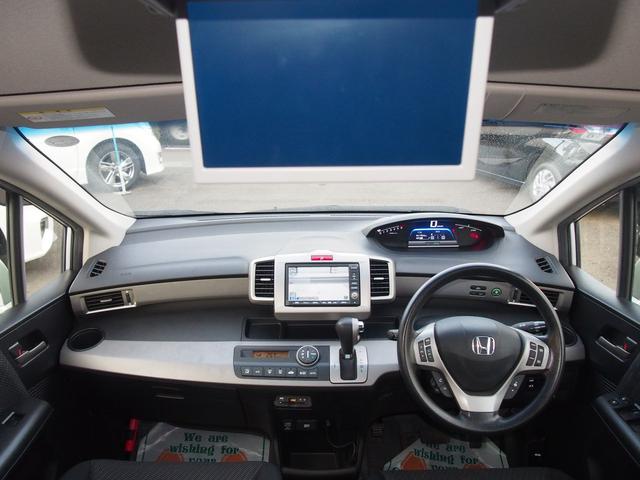 フリードハイブリッド ジャストセレクション　ＨＤＤナビ　後席モニター　バックカメラ　電動ドア　６人乗り　スマートキー　２列目キャプテンシート　右側オートクロージャードア　純正エアロ　ＨＩＤライト　ウィンカードアミラー　１セグＴＶ　ＤＶＤ　ＣＤ録音　クルコン　横滑り防止　ＥＴＣ　禁煙車（10枚目）