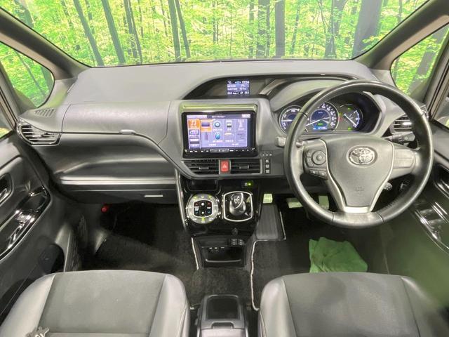 ノア ハイブリッドＳｉ　ダブルバイビーＩＩ　禁煙車　衝突軽減装置　後席モニター　ＢＩＧ－Ｘ９型ナビ　バックカメラ　両側電動スライド　ハーフレザーシート　前席シートヒーター　ＬＥＤヘッド　スマートキー　ドラレコ　ＥＴＣ　リアオートエアコン（2枚目）