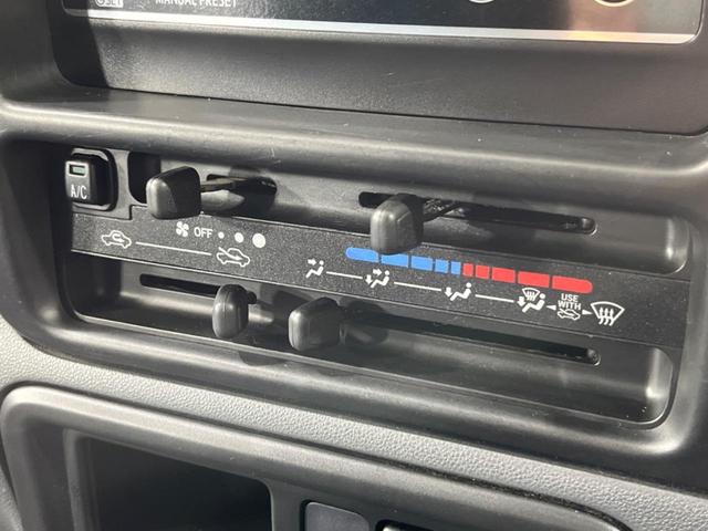 ハイゼットカーゴ クルーズ　禁煙車　５ＭＴ　純正オーディオ　キーレスエントリー　電動格納ミラー（7枚目）