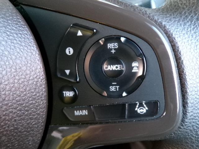 Ｎ－ＷＧＮ Ｌホンダセンシング　４ＷＤ　ギャザズナビＴＶ　ＤＶＤ　ＣＤ　Ｂｌｕｅｔｏｏｔｈ　バックカメラ　アイドリングストップ　横滑り防止付き　ＥＴＣ　プライバシーガラス　クルーズコントロール　シートヒーター　パーキングセンサー　１４インチアルミホイール　電動パーキング（22枚目）