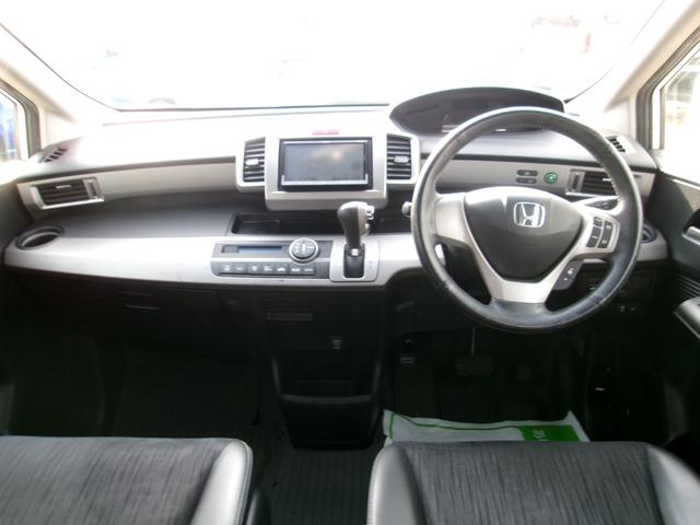 フリードハイブリッド ジャストセレクション　メモリーナビＴＶ　バックカメラ　ディスチャージヘッドライト　両側パワースライドドア　社外１５インチアルミホイル　オートクルーズコントロール　ＥＴＣ車載器　スマートキー（9枚目）