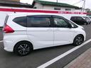 フリードハイブリッド ハイブリッド・Ｇホンダセンシング　メモリーナビＴＶ　バックカメラ　ＬＥＤヘッドライト　両側パワースライドドア　純正１５インチアルミホイル　オートクルーズコントロール　ＥＴＣ車載器　スマートキー（5枚目）