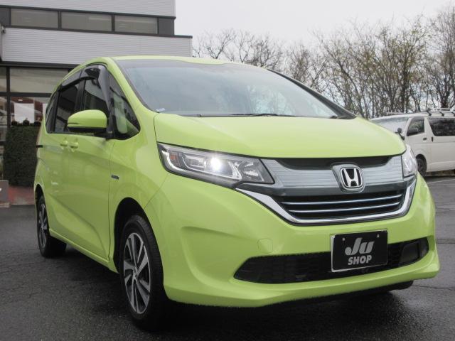 フリードハイブリッド ハイブリッド・Ｇホンダセンシング　４ＷＤ　ナビ　フルセグＴＶ　Ｂｌｕｅｔｏｏｔｈ　ＣＤ＆ＤＶＤ再生　バックカメラ　両側パワースライドドア　ドラレコ　ＬＥＤヘッドランプ　フロントワイパーデアイサー　ビルトインＥＴＣ　ドラレコ　クルコン（5枚目）