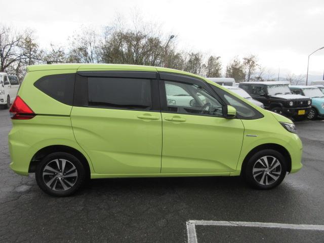 フリードハイブリッド ハイブリッド・Ｇホンダセンシング　４ＷＤ　ナビ　フルセグＴＶ　Ｂｌｕｅｔｏｏｔｈ　ＣＤ＆ＤＶＤ再生　バックカメラ　両側パワースライドドア　ドラレコ　ＬＥＤヘッドランプ　フロントワイパーデアイサー　ビルトインＥＴＣ　ドラレコ　クルコン（6枚目）