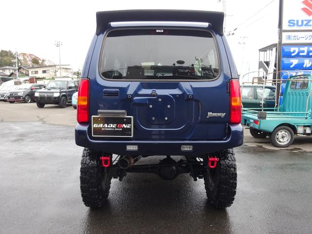 ジムニー ＸＣ　リフトＵＰ　ヨコハマジオランダーＸ－ＭＴ　ＦＡＲＭアルミ　ハイブリッジファーストリーディングアーム　Ｋ－プロダクツ減衰調整ショックサスペンション　調整式ラテラルロッド　社外マフラーバンパーリアスポイラ（6枚目）