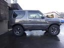 ジムニー クロスアドベンチャー 社外F/Rショートバンパー 社外スキッドプレート 社外マフラー YOKOHAMAジオランダーM/Tタイヤ 社外16インチアルミ 社外LEDテール 社外リアスポイラー キーレス シートヒーター 5MT(4枚目)