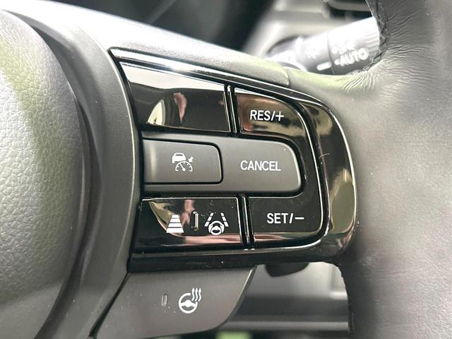 ヴェゼル e:HEV Z 4WD 禁煙車 メーカー9型ナビ バックカメラ 寒冷地仕様 衝突軽減装置 アダプティブクルーズ 電動リアゲート ハーフレザーシート ドラレコ コーナーセンサー スマートキー LEDヘッド ETC2.0(5枚目)