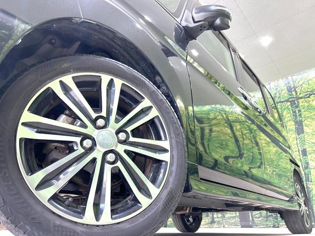 タント カスタムＲＳ　トップエディションＳＡＩＩＩ　後期型　禁煙車　ターボ　両側電動ドア　純正８型ナビ　バックカメラ　衝突軽減装置　ハーフレザー　シートヒーター　コーナーセンサー　スマートキー　ＬＥＤヘッド　ＥＴＣ　オートライト　革巻きハンドル（13枚目）