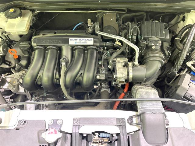 ヴェゼル ハイブリッドＺ　禁煙車　モデューロ１６インチホイール　茶内装　寒冷地仕様　ナビ　バックカメラ　衝突軽減装置　クルーズコントロール　シートヒーター　ＬＥＤヘッド　コーナーセンサー　ＥＴＣ　ルーフレール　フルセグ（18枚目）