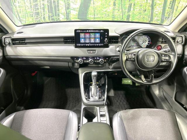 ヴェゼル e:HEV Z 禁煙車 純正9型ナビ バックカメラ 寒冷地仕様 衝突被害軽減装置 電動リアゲート ドラレコ コーナーセンサー スマートキー LEDヘッド ETC2.0 オートマチックハイビーム 車線逸脱警報 フルセグ(2枚目)