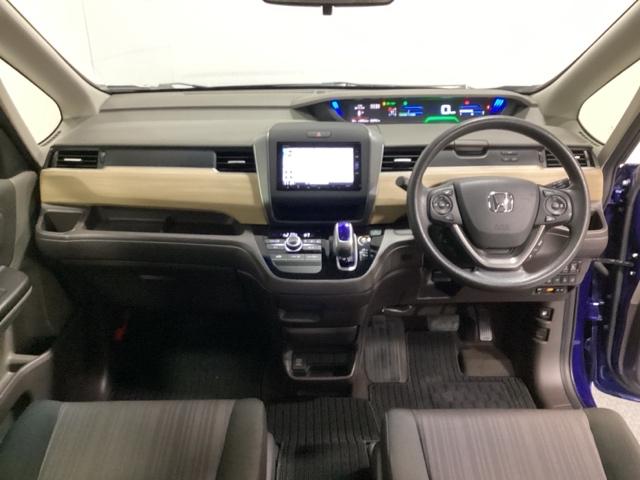 フリードハイブリッド ハイブリッド・Ｇホンダセンシング　６人乗り　ワンオーナー　フルセグＴＶ　ＤＶＤ再生　ＥＴＣ　光触媒抗菌消臭施工済　軽減ブレーキ　キーフリーシステム　１オ－ナ－　ＥＣＯＮ　後カメラ　Ａクルーズ　ＬＥＤヘッドランプ　横滑防止　３列シート（5枚目）