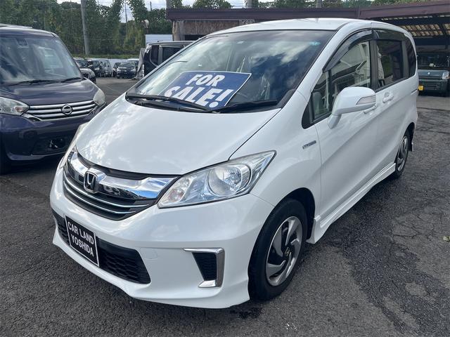 フリードハイブリッド ハイブリッド プレミアムエディション ハイブリッドプレミアムエディション CVT アイドリングストップ キーレスエントリー スマートキー 両側電動スライドドア ナビ バックカメラ 前方ドライブレコーダー フリップダウンモニター(2枚目)