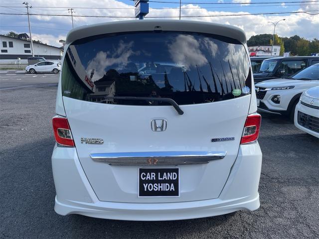 フリードハイブリッド ハイブリッド プレミアムエディション ハイブリッドプレミアムエディション CVT アイドリングストップ キーレスエントリー スマートキー 両側電動スライドドア ナビ バックカメラ 前方ドライブレコーダー フリップダウンモニター(7枚目)