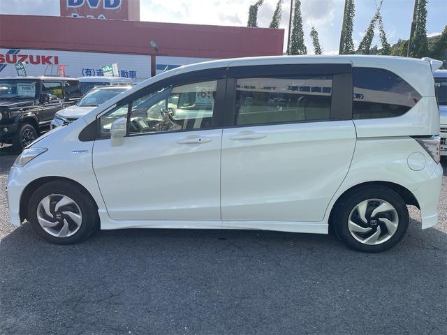 フリードハイブリッド ハイブリッド プレミアムエディション ハイブリッドプレミアムエディション CVT アイドリングストップ キーレスエントリー スマートキー 両側電動スライドドア ナビ バックカメラ 前方ドライブレコーダー フリップダウンモニター(9枚目)