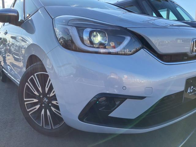 フィット ｅ：ＨＥＶリュクス　純正９インチナビ　フルセグＴＶ　Ｂカメラ　Ｂｌｕｅｔｏｏｔｈ　ＣＤ　ＤＶＤ　ハーフレザーシート　シートヒーター　ＬＥＤヘッドライト　アダプティブクルーズコントロール　レーンキープ　純正１６インチＡＷ（31枚目）