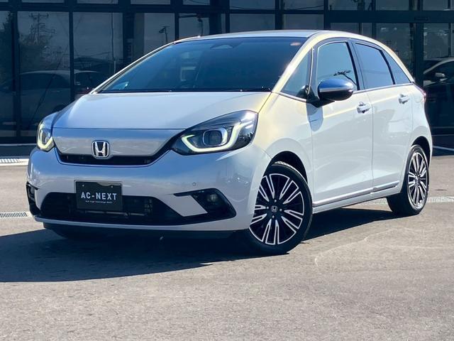 フィット ｅ：ＨＥＶリュクス　純正９インチナビ　フルセグＴＶ　Ｂカメラ　Ｂｌｕｅｔｏｏｔｈ　ＣＤ　ＤＶＤ　ハーフレザーシート　シートヒーター　ＬＥＤヘッドライト　アダプティブクルーズコントロール　レーンキープ　純正１６インチＡＷ（34枚目）