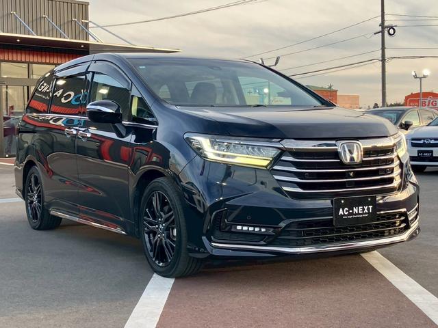 オデッセイハイブリッド ｅ：ＨＥＶアブソルート・ＥＸ　純正１０インチナビ　全周囲カメラ　フルセグＴＶ　Ｂｌｕｅｔｏｏｔｈ　純正後部座席モニター　ＡＣＣ　ドラレコ　両側電動スライドドア　パワーバックドア　Ｐシート　シートヒーター　Ｐアシスト　オットマン（23枚目）