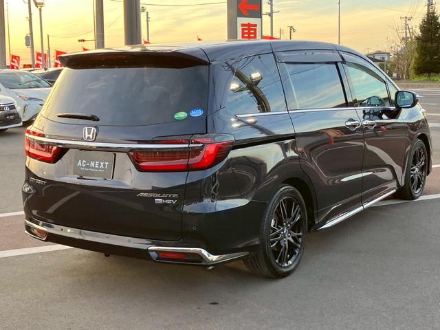 オデッセイハイブリッド ｅ：ＨＥＶアブソルート・ＥＸ　純正１０インチナビ　全周囲カメラ　フルセグＴＶ　Ｂｌｕｅｔｏｏｔｈ　純正後部座席モニター　ＡＣＣ　ドラレコ　両側電動スライドドア　パワーバックドア　Ｐシート　シートヒーター　Ｐアシスト　オットマン（25枚目）