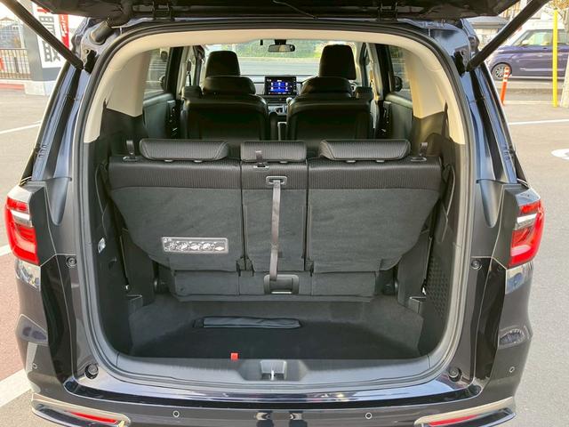 オデッセイハイブリッド ｅ：ＨＥＶアブソルート・ＥＸ　純正１０インチナビ　全周囲カメラ　フルセグＴＶ　Ｂｌｕｅｔｏｏｔｈ　純正後部座席モニター　ＡＣＣ　ドラレコ　両側電動スライドドア　パワーバックドア　Ｐシート　シートヒーター　Ｐアシスト　オットマン（31枚目）