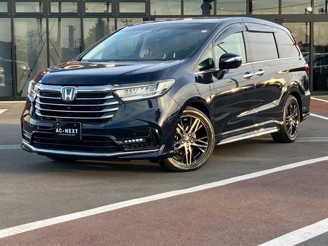 オデッセイハイブリッド ｅ：ＨＥＶアブソルート・ＥＸ　純正１０インチナビ　全周囲カメラ　フルセグＴＶ　Ｂｌｕｅｔｏｏｔｈ　純正後部座席モニター　ＡＣＣ　ドラレコ　両側電動スライドドア　パワーバックドア　Ｐシート　シートヒーター　Ｐアシスト　オットマン（40枚目）