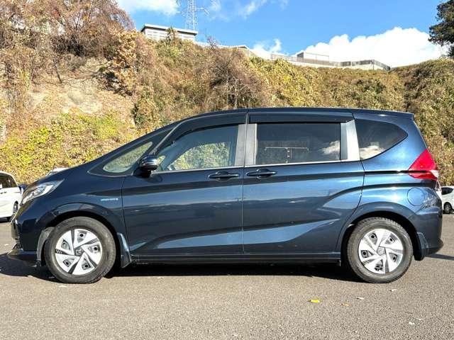 フリードハイブリッド ハイブリッド・Ｇホンダセンシング　ホンダセンシング！ギャザーズナビ＆フルセグＴＶ＆ＤＶＤ＆ＢＴ＆バックカメラ！ＬＥＤヘッドライト！オートライト！シートヒーター！両側パワースライドドア！純正ＥＴＣ！スマートキーシステム（8枚目）