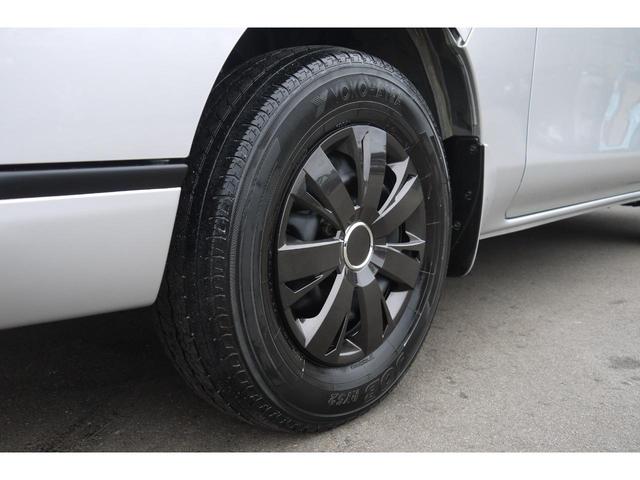 NV350キャラバンバン ロングDXターボ 4WD ディーゼルターボ 低床 リアヒーター プライバシーガラス 両側スライドドア Bluetooth対応純正メモリーナビ ハンズフリー バックカメラ キーレス 社外ブラックホイールキャップ(48枚目)