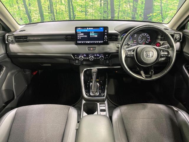 ヴェゼル ｅ：ＨＥＶ　Ｚ　純正９型ナビ　バックカメラ　衝突軽減　レーダークルーズ　禁煙車　パワーバックドア　合皮シート　シートヒーター　ドラレコ　ＥＴＣ　コーナーセンサー　レーンキープ　スマートキー　ステアリングヒーター（2枚目）
