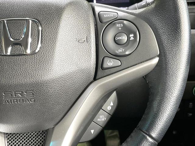 フィットハイブリッド Ｌ　ホンダセンシング　純正８型ナビ　衝突軽減装置　レーダークルーズ　禁煙　バックカメラ　ＥＴＣ　ＬＥＤヘッドライト　オートライト　オートエアコン　Ｂｌｕｅｔｏｏｔｈ接続　スマートキー　プッシュスタート　純正１５インチアルミ（7枚目）