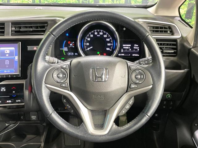 フィットハイブリッド Ｌ　ホンダセンシング　純正８型ナビ　衝突軽減装置　レーダークルーズ　禁煙　バックカメラ　ＥＴＣ　ＬＥＤヘッドライト　オートライト　オートエアコン　Ｂｌｕｅｔｏｏｔｈ接続　スマートキー　プッシュスタート　純正１５インチアルミ（11枚目）