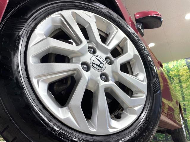 フィットハイブリッド Ｌ　ホンダセンシング　純正８型ナビ　衝突軽減装置　レーダークルーズ　禁煙　バックカメラ　ＥＴＣ　ＬＥＤヘッドライト　オートライト　オートエアコン　Ｂｌｕｅｔｏｏｔｈ接続　スマートキー　プッシュスタート　純正１５インチアルミ（13枚目）