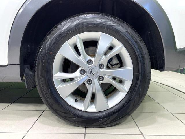 ヴェゼル ハイブリッドX・ホンダセンシング 純正SDナビ バックカメラ 衝突被害軽減システム 禁煙車 スマートキー LEDヘッド ビルトインETC 純正16インチアルミ 車線逸脱警報 オートライト デュアルエアコン Bluetooth CD(29枚目)