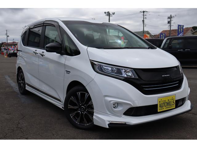 フリードハイブリッド ハイブリッド・ＥＸ　車検整備付　１年保証付　走行距離無制限　無限・Ｍｏｄｕｌｏエアロ　社１６アルミ　両側パワースライドドア　ＥＴＣ　クルコン　ＬＥＤライト　フルセグナビ　リアモニター　ドラレコ　Ｂカメラ（5枚目）