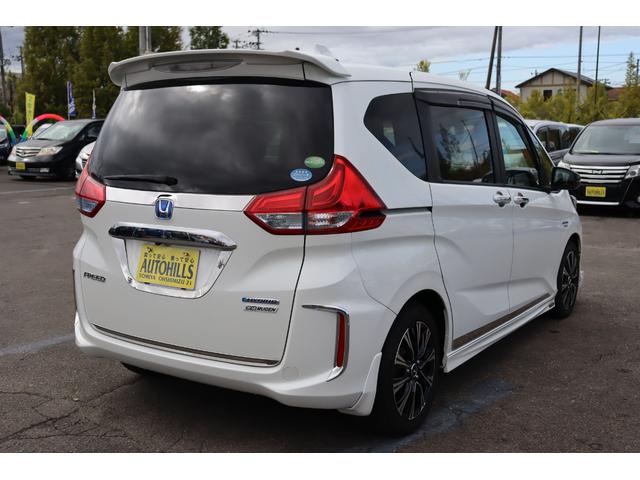 フリードハイブリッド ハイブリッド・ＥＸ　車検整備付　１年保証付　走行距離無制限　無限・Ｍｏｄｕｌｏエアロ　社１６アルミ　両側パワースライドドア　ＥＴＣ　クルコン　ＬＥＤライト　フルセグナビ　リアモニター　ドラレコ　Ｂカメラ（6枚目）