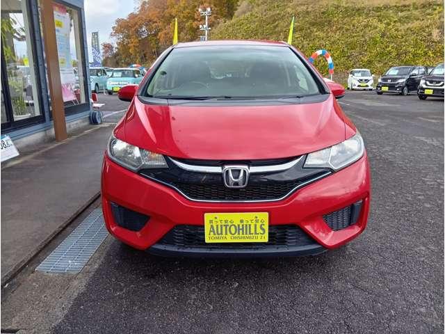 フィットハイブリッド Ｆパッケージ　４ＷＤ　スマートキー　社外ナビ　フルセグＴＶ　Ｂｌｕｅｔｏｏｔｈ　ＤＶＤ再生　Ｂカメラ　ステアリングスイッチ　ワイパーデアイサー　純正１５インチアルミホイール　保証付き（10枚目）